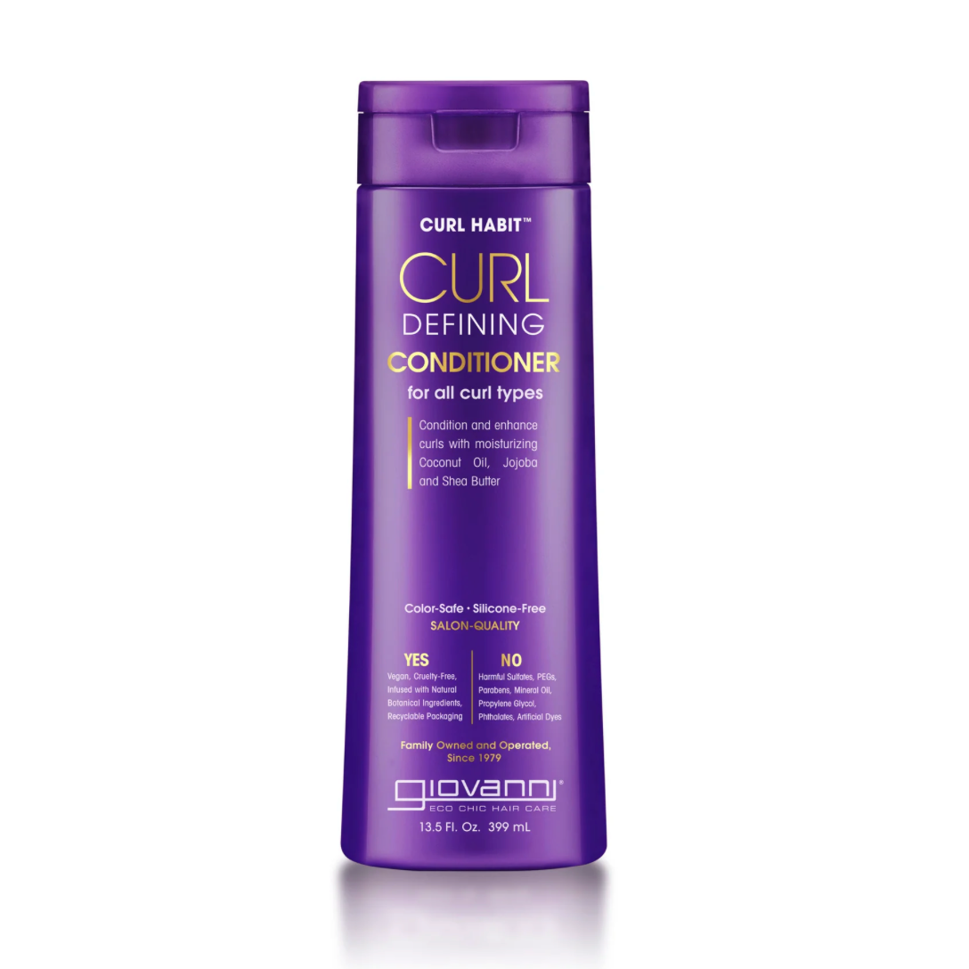 Purple bottle of Curl Habit conditioner on a white background