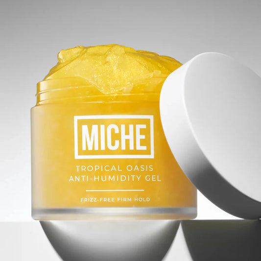 Yellow jar of Miche Tropical Oasis Anti-Humidity Gel on a gray background
