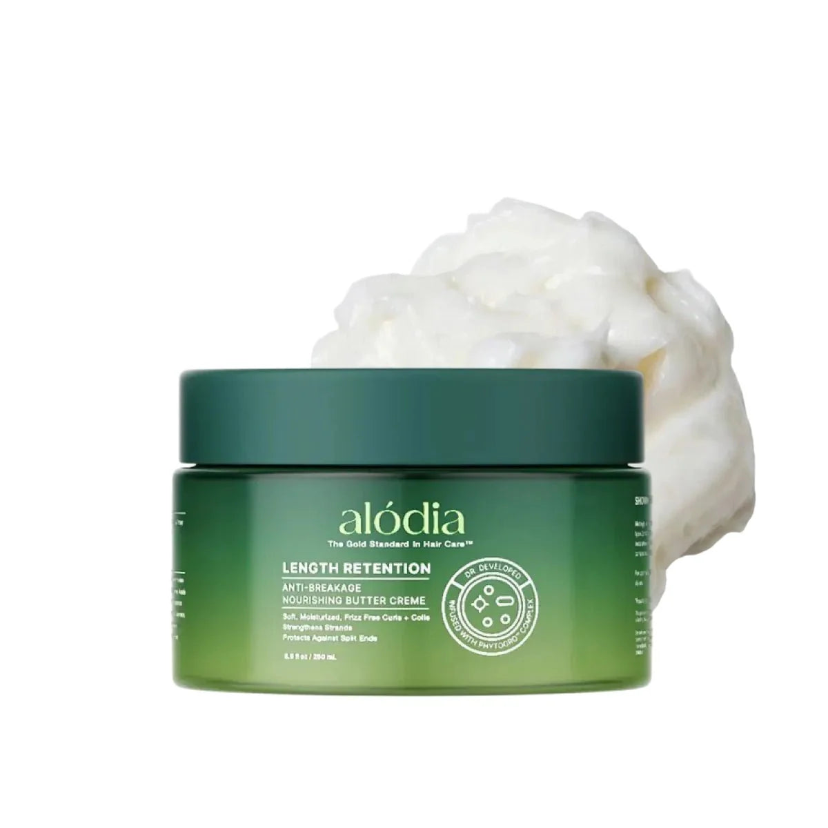 Green jar of alodia Length Retention Nourishing Butter Crème with white cream on a white background