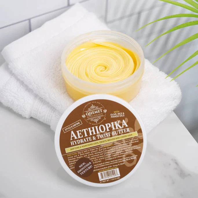 Aethiopika hydrate & twist butter container with lid on a white towel