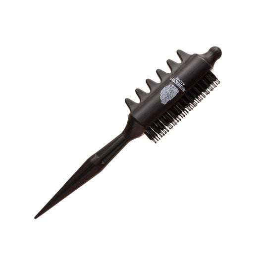 Black hairbrush with unique bristle design on a beige background