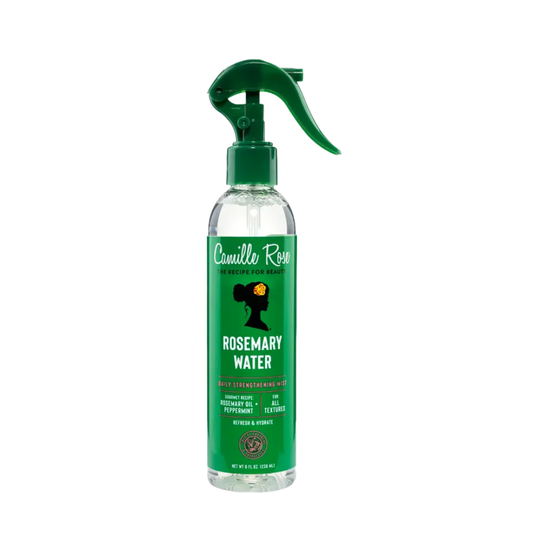 Clear spray bottle with green nozzle and label on a white background
