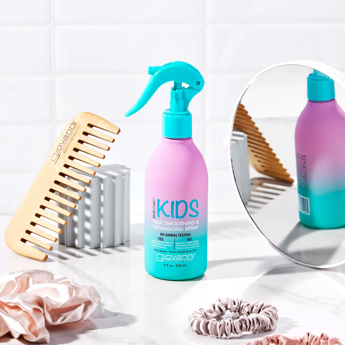 Purple and blue hair care product with a spray nozzle, wood comb, and hair accessories on a white surface.