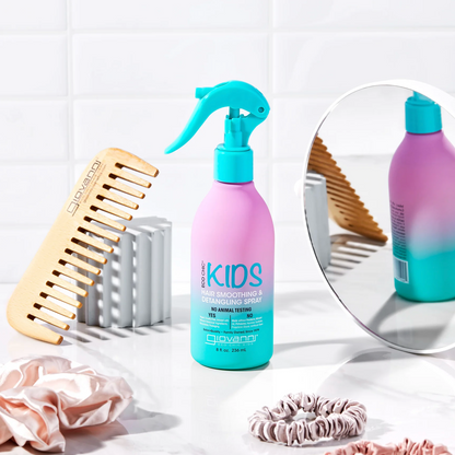 Purple and blue hair care product with a spray nozzle, wood comb, and hair accessories on a white surface.
