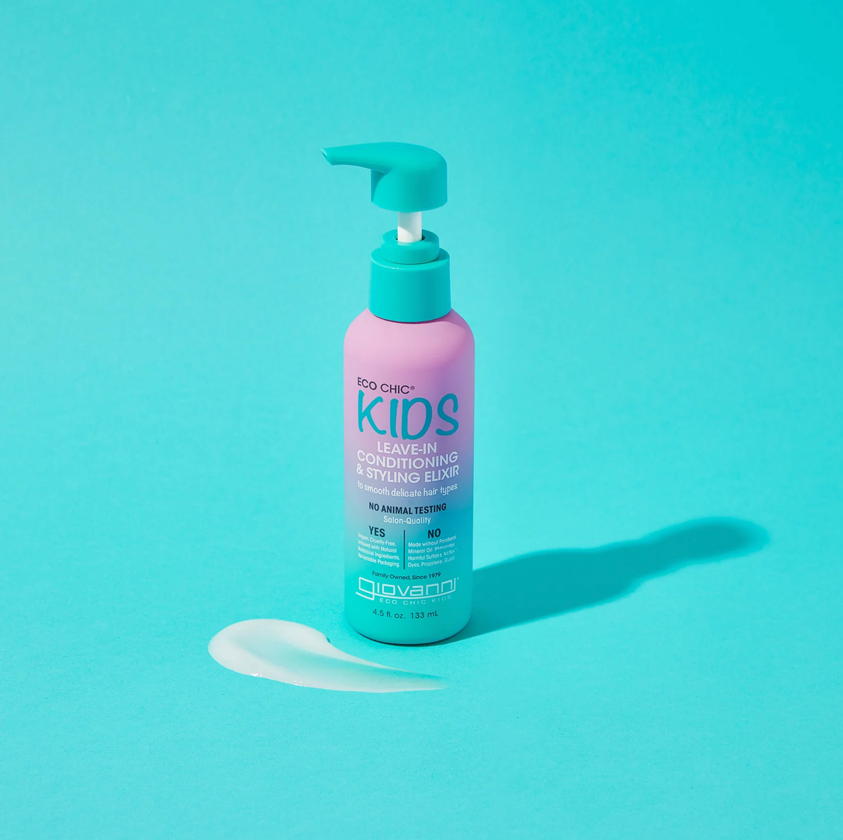 Bottle of Kids Leave-In Conditioning & Styling Elixir on a teal background