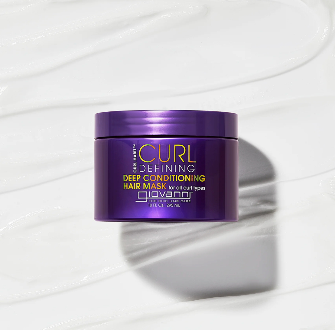 Purple jar of Giovanni Curl Defining Deep Conditioning Hair Mask on a white background