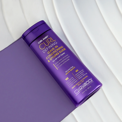 Purple bottle of Curl Habit hair product on a white surface