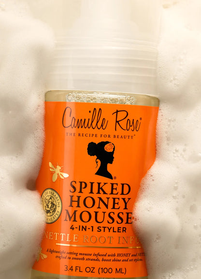 Camille Rose Spiked Honey Mousse container on a textured white background