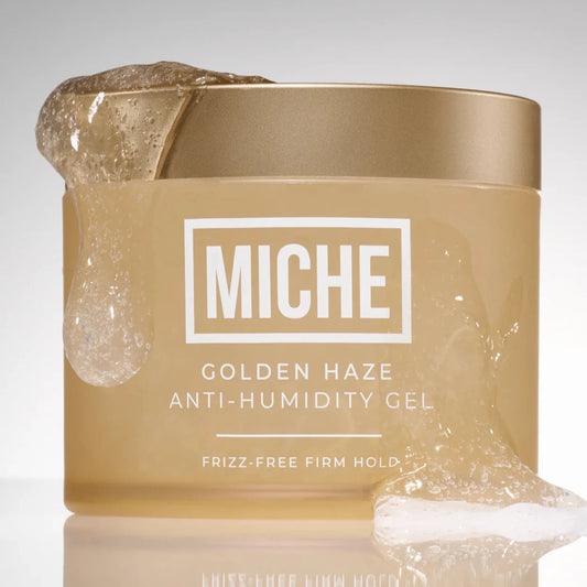 Jar of Miche Golden Haze Anti-Humidity Gel on a gray background