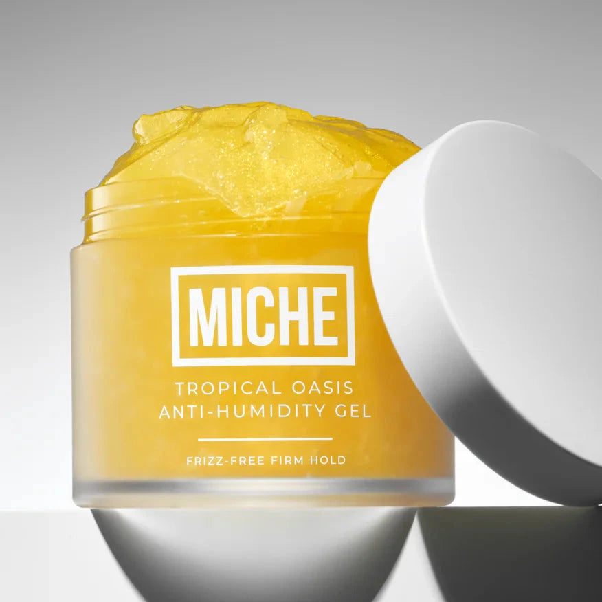 Yellow jar of Miche Tropical Oasis Anti-Humidity Gel on a gray background
