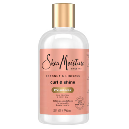 Shea Moisture coconut & hibiscus curl & shine styling milk bottle on a white background