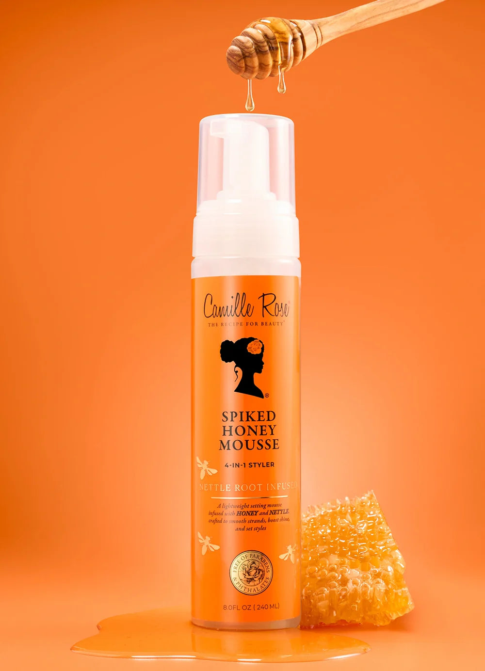 Spiked Honey Mousse bottle with honeycomb and honey drizzle on an orange background