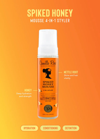 Camille Rose Spiked Honey Mousse 4-in-1 Styler bottle on an orange background