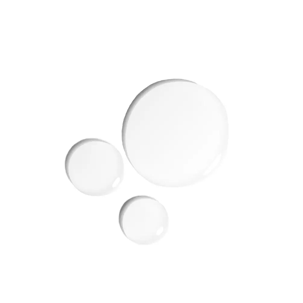 Three clear, glossy liquid droplets of varying sizes on a solid white background.