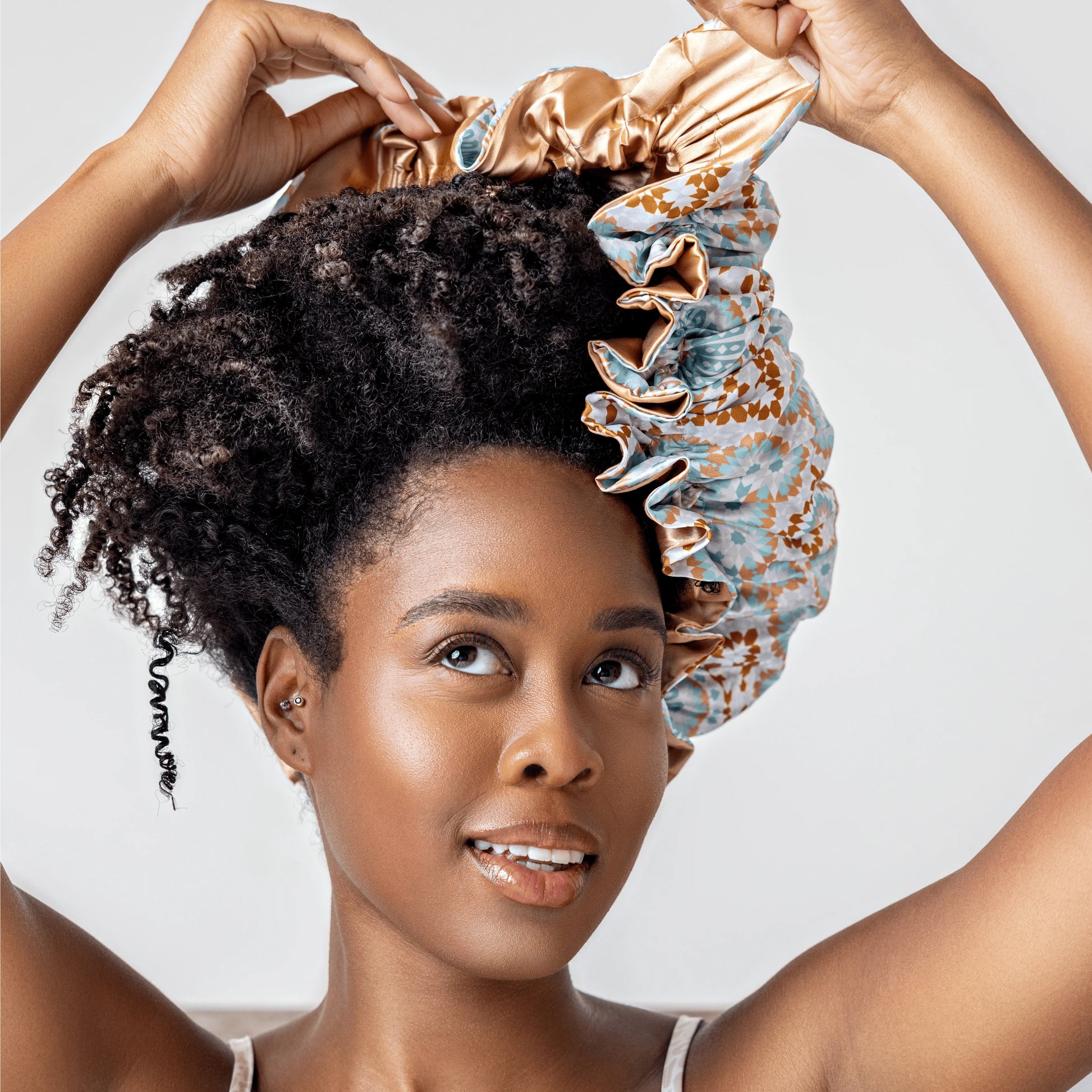 overnight hair mask with satin bonnet on curly hair