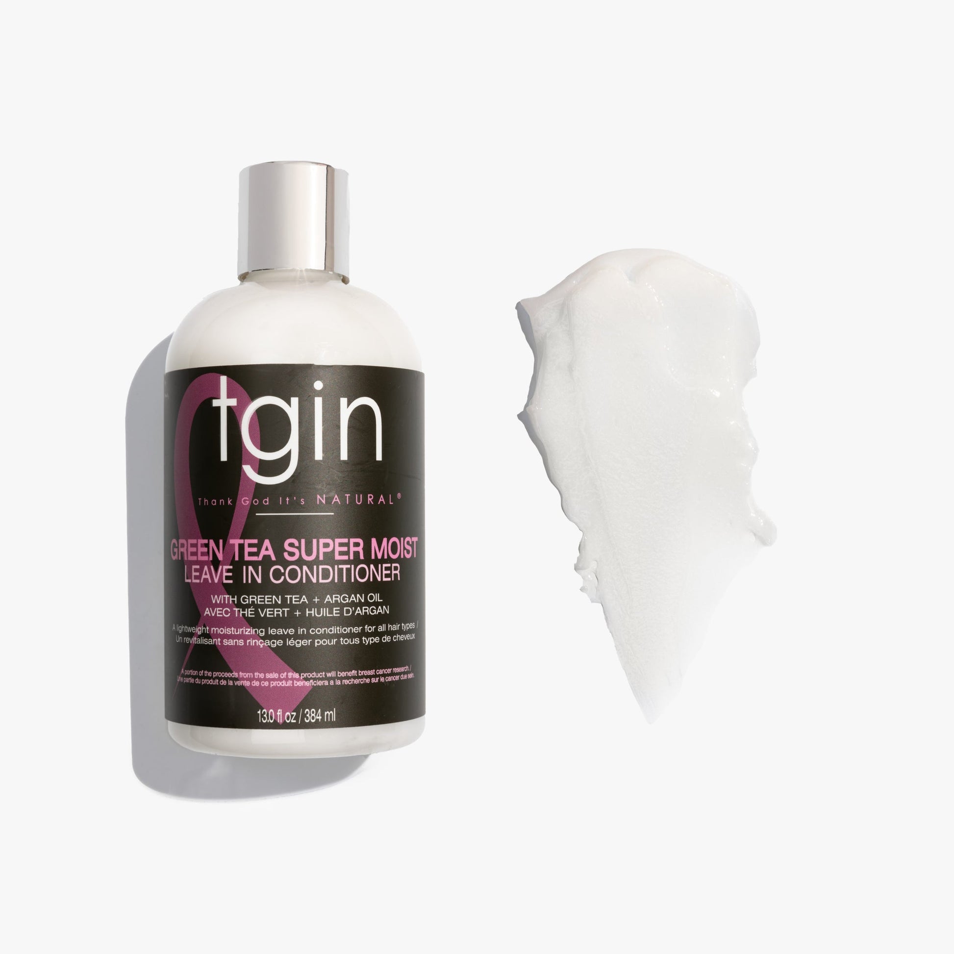 tgin Green Tea Super Moist Leave In Conditioner bottle with a sample on a white background